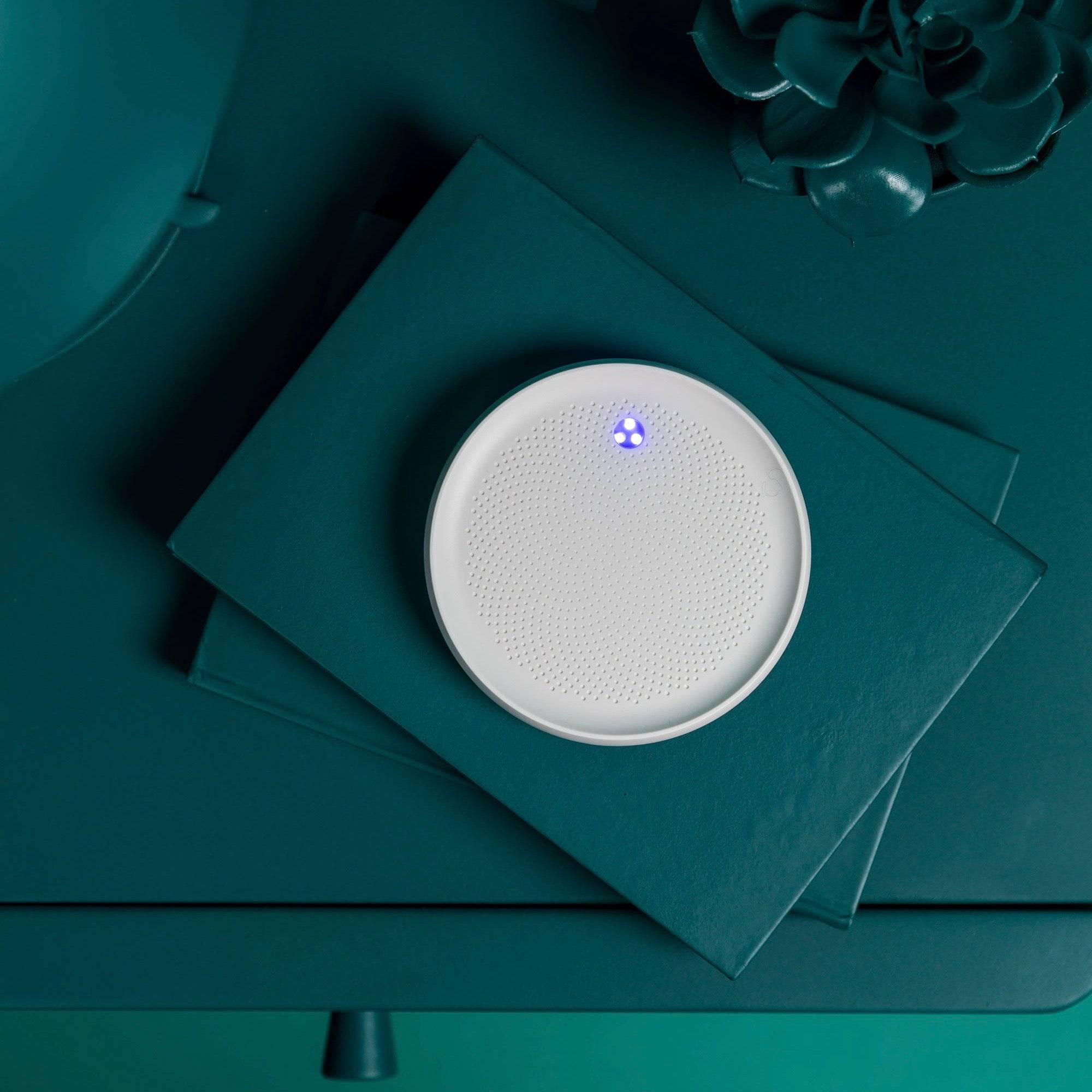 Dodow sleep aid by LIVLAB, featuring a circular light display designed to promote relaxation and improve sleep in 8 minutes.