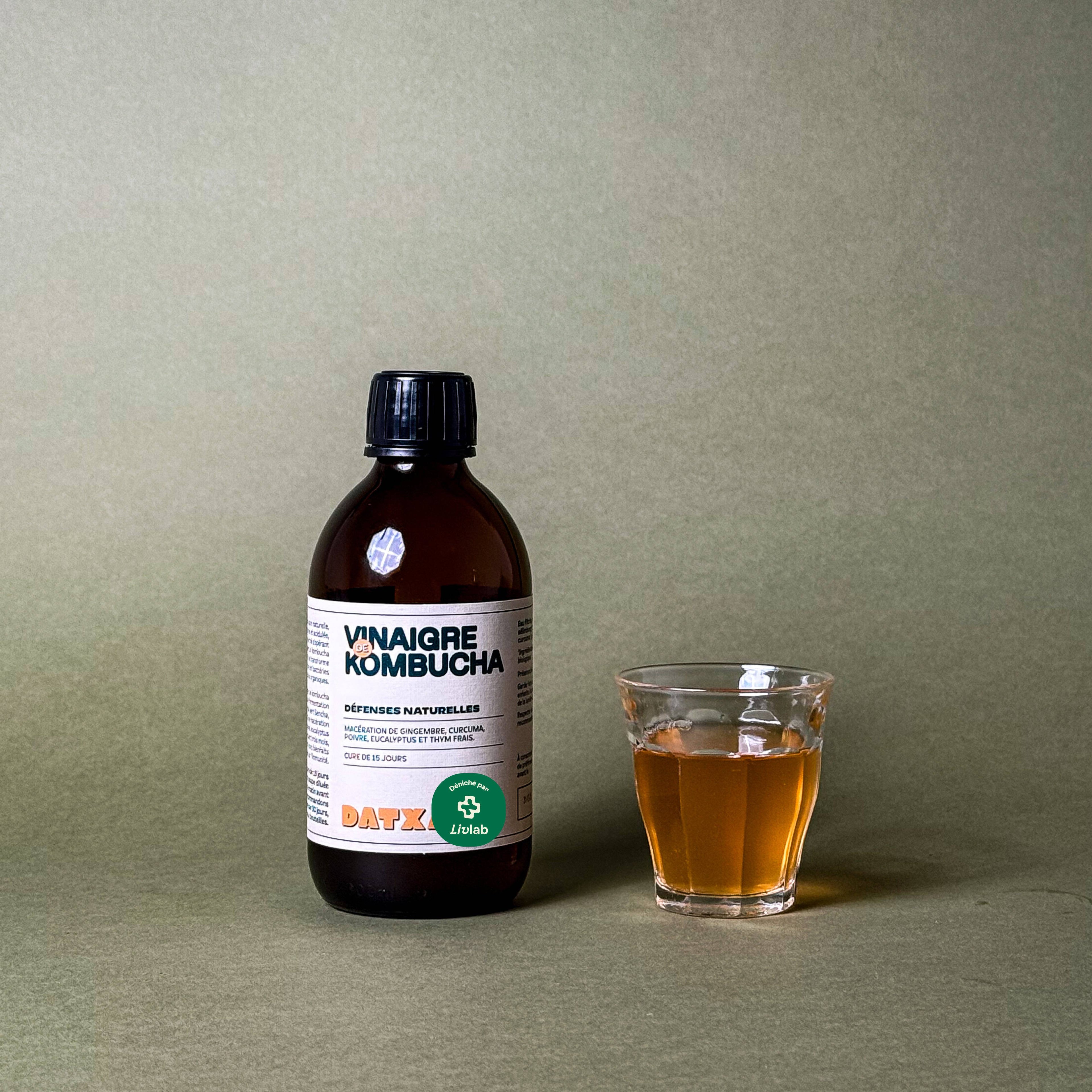 300 ml bottle of Livlab Kombucha vinegar with a clear liquid and a label showcasing product details.