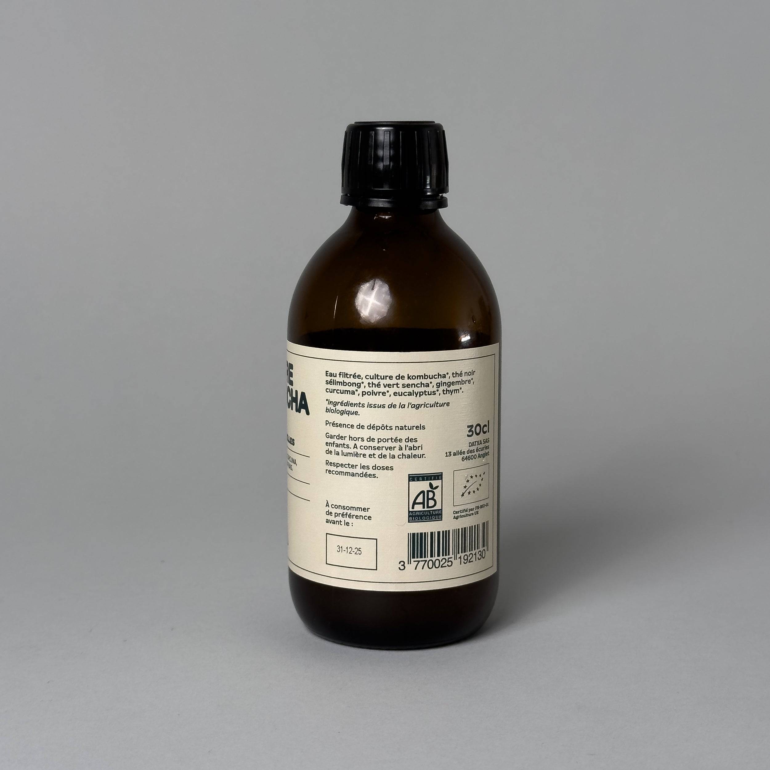 300 ml bottle of Livlab Kombucha Vinegar with a fermented texture and natural color displayed on a wooden surface.