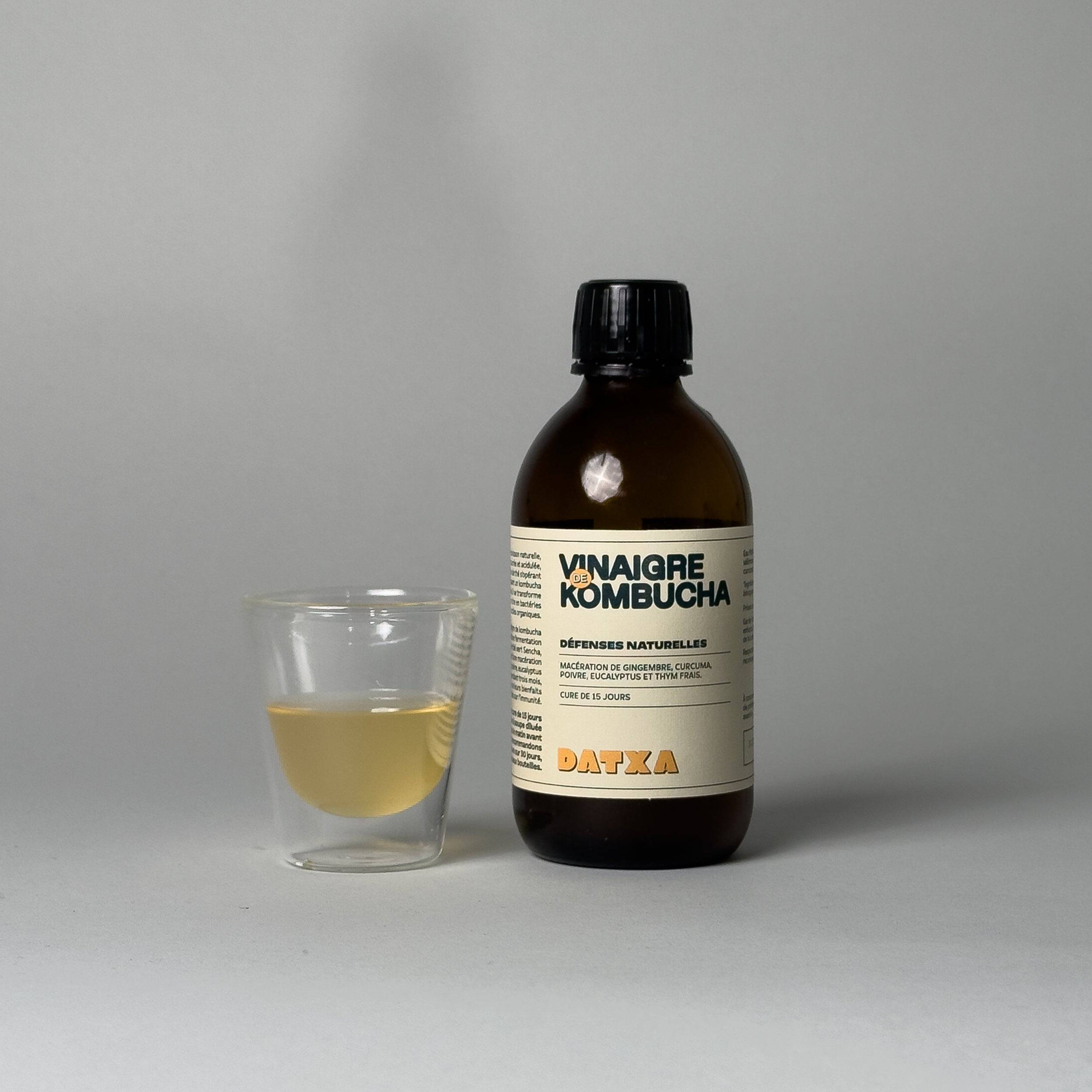 300 ml bottle of Livlab Kombucha vinegar with a clear liquid and a cork stopper, set against a neutral background.
