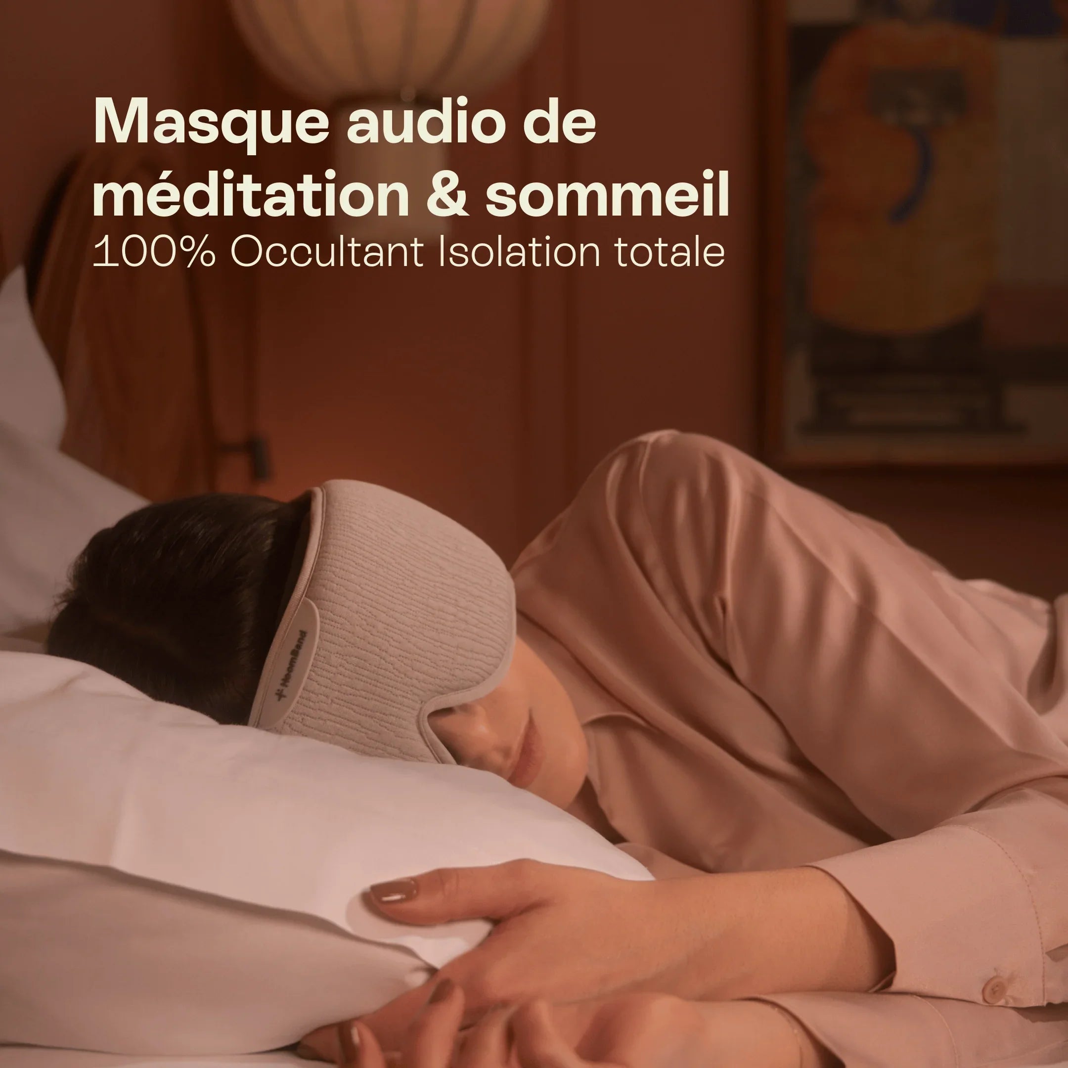 Woman sleeping on bed wearing a wireless audio sleep and meditation mask, soft lighting