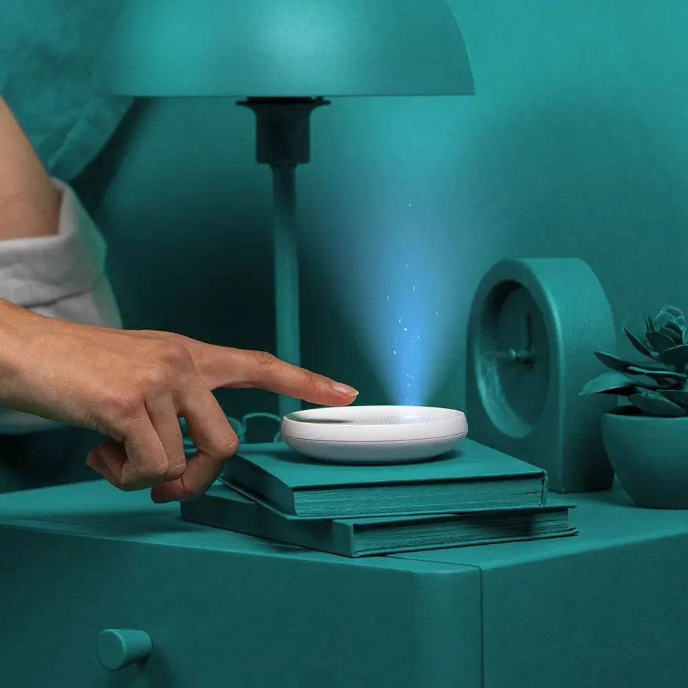 Dodow sleep aid by Livlab, featuring a circular light guide and a sleek design for relaxation in 8 minutes.