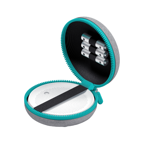 Portable round sleep aid device in zippered teal and gray case with battery holder